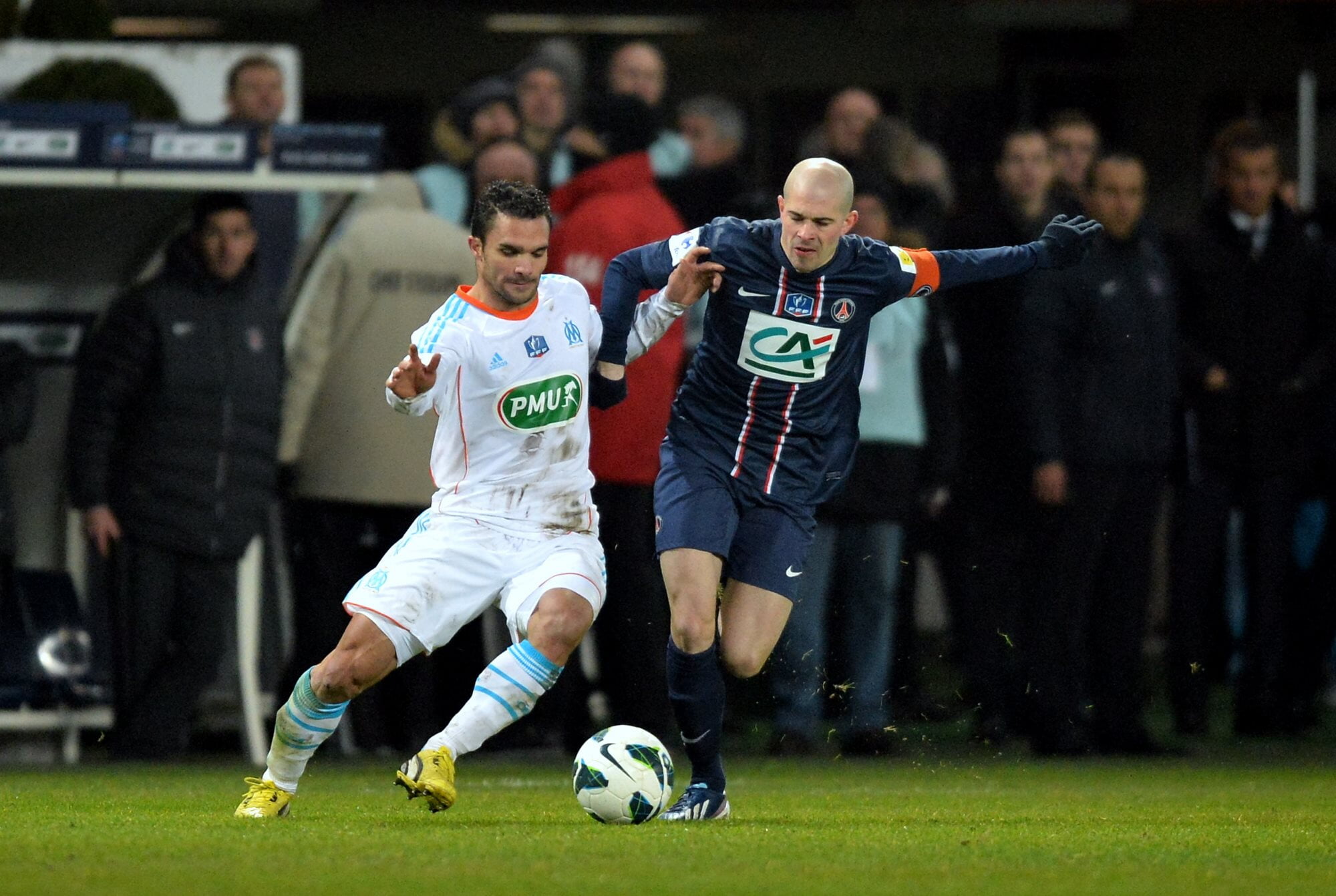 Olympique de Marseille's Jérémy Morel and Paris Saint-Germain's Christophe Jallet battle for the ball