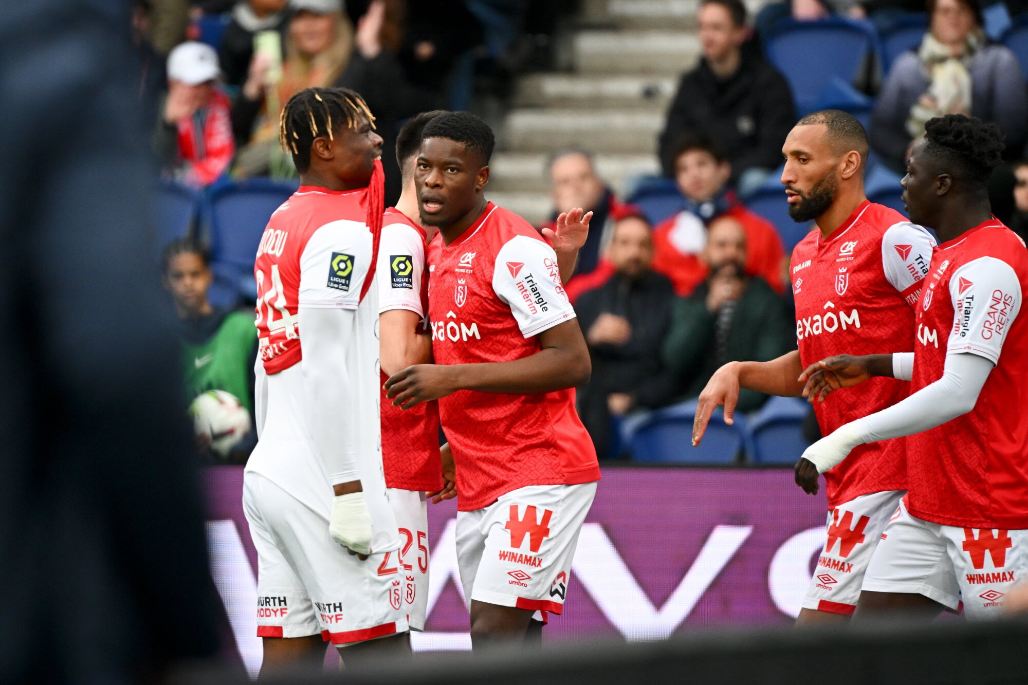 Stade de Reims' Marshall Munetsi celebrates a goal against PSG