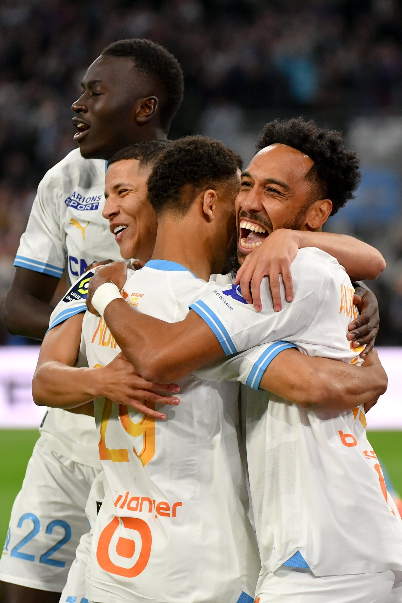 Olympique de Marseille's Pierre-Emerick Aubameyang celebrates with teammates including Amine Harit and Pape Gueye