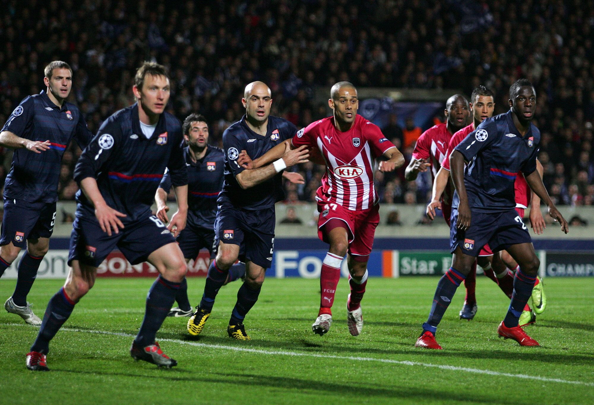 Players from Olympique Lyonnais and Girondins de Bordeaux face off in the UEFA Champions League