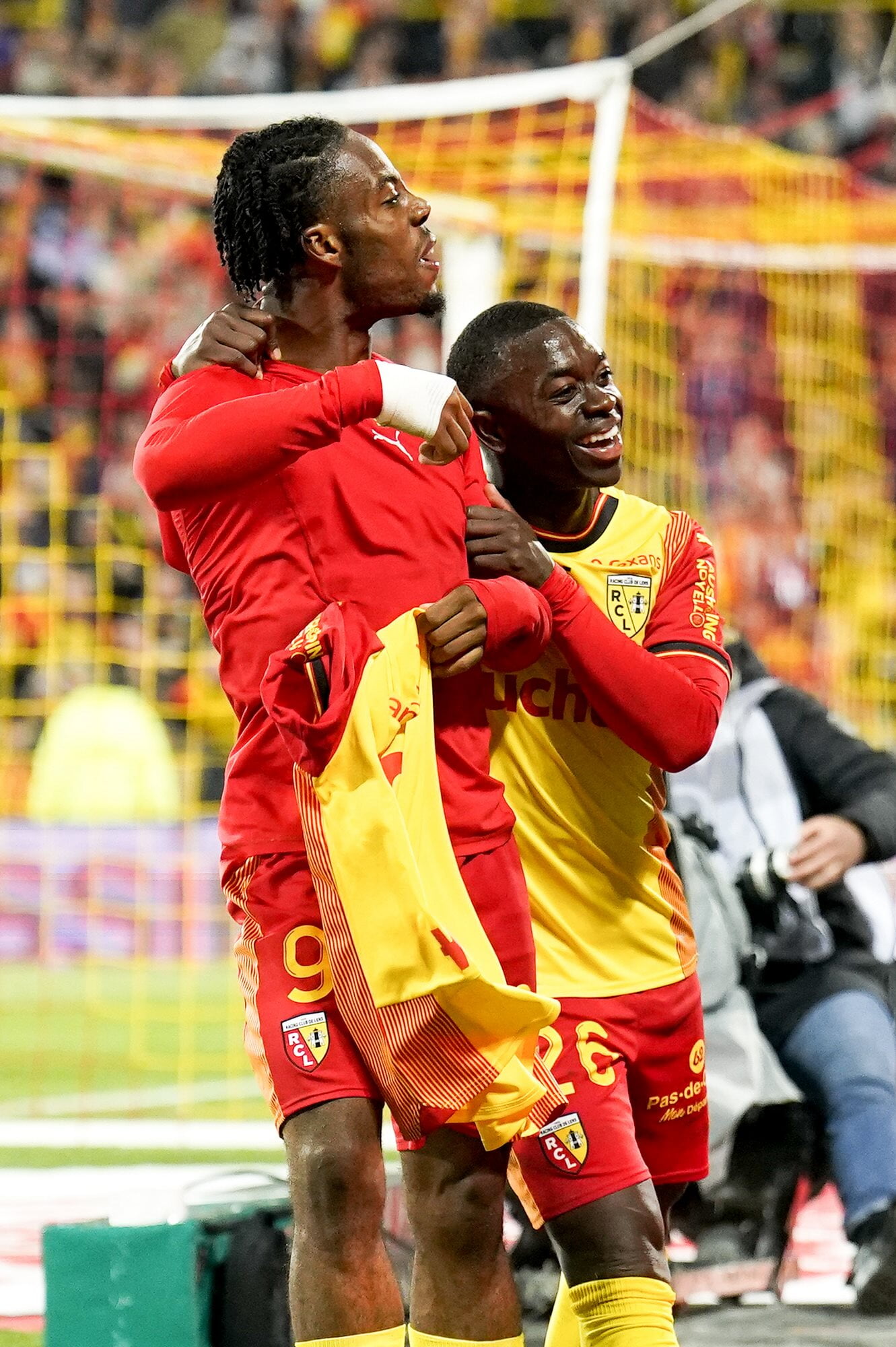 RC Lens' Elye Wahi and Nampalys Mendy celebrate the striker's goal against FC Lorient
