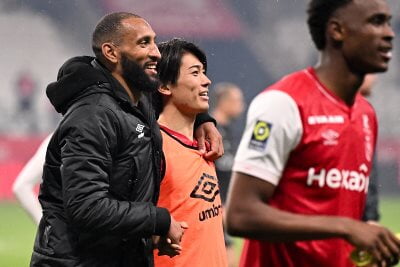 Stade de Reims defender Yunis Abdelhamid with teammate Keito Nakamura after his side's win over Olympique de Marseille